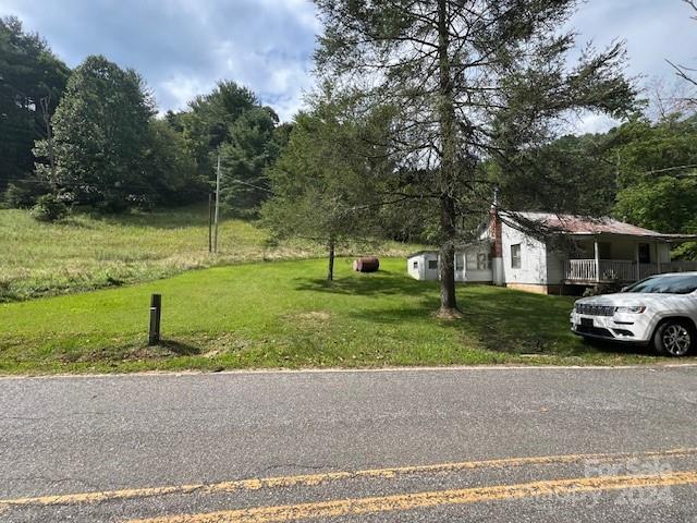 1030 Long Branch Road Green Mountain, NC 28740 - Photo 7 of 16 a view of a house with a back yard