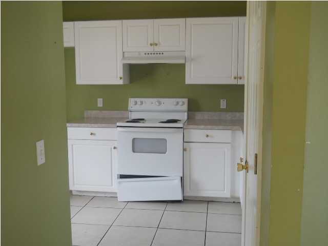 7676 Chablis Circle Navarre, FL 32566 - Photo 4 of 10 a utility room with sink dryer and washer
