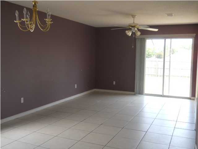 7676 Chablis Circle Navarre, FL 32566 - Photo 5 of 10 a view of an empty room with a window
