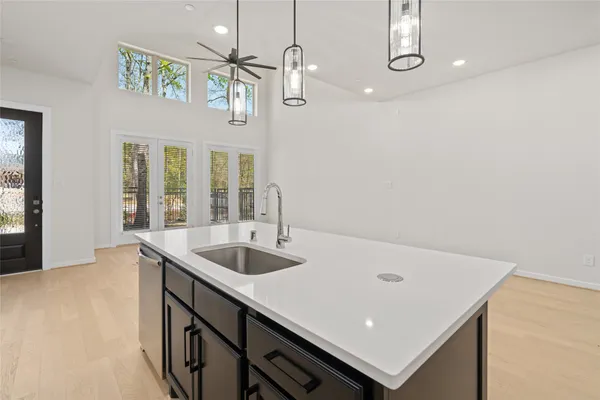 a kitchen with stainless steel appliances a cabinets and a stove top oven