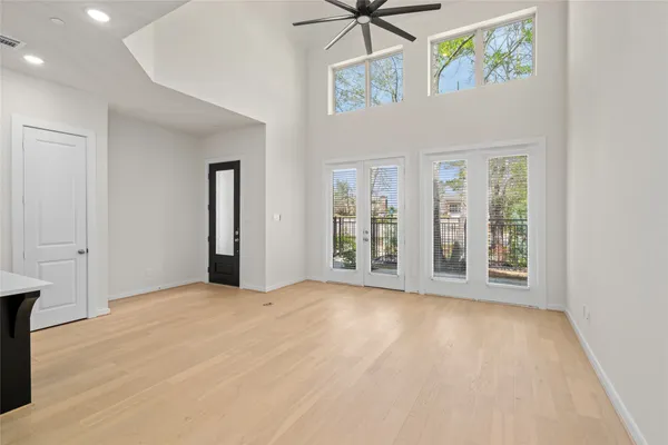 a view of a kitchen with a sink stainless steel appliances and cabinets