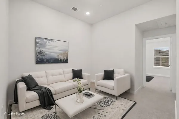 a living room with furniture and a couch