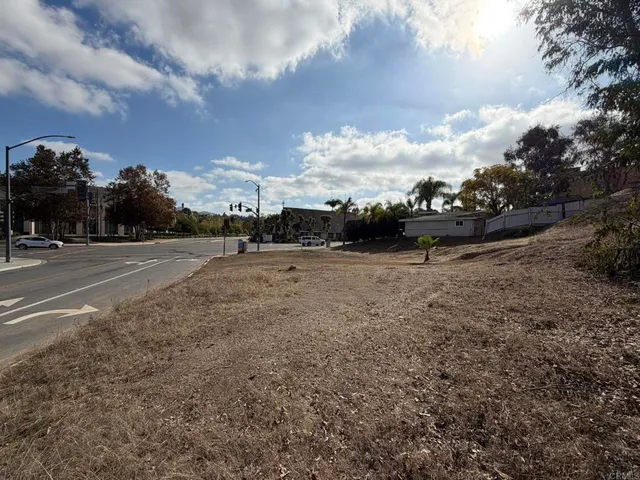 a view of outdoor space with playground and green space