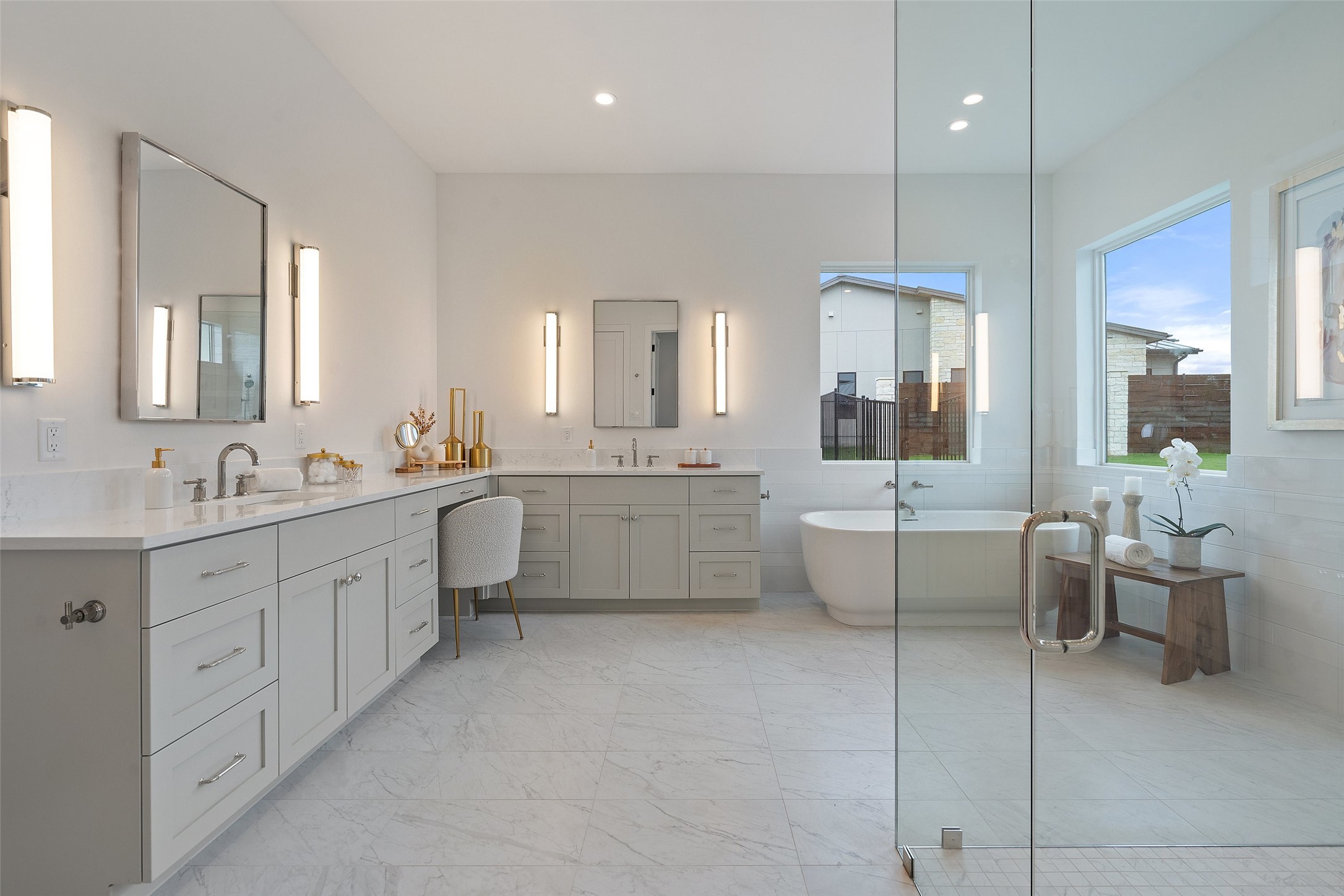 17212 Morning Grove Lane Austin, TX 78738 - Photo 19 of 38 a large bathroom with a double vanity sink a mirror and a bathtub