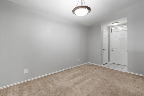 a view of kitchen with sink and refrigerator
