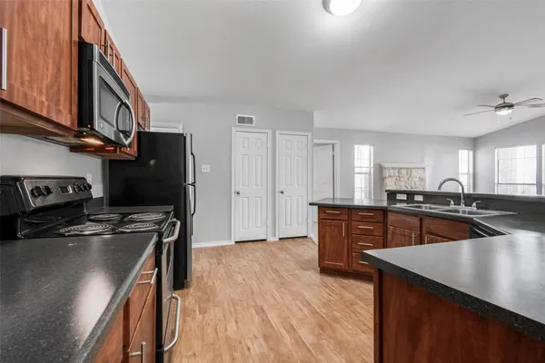 a view of kitchen and kitchen with sink
