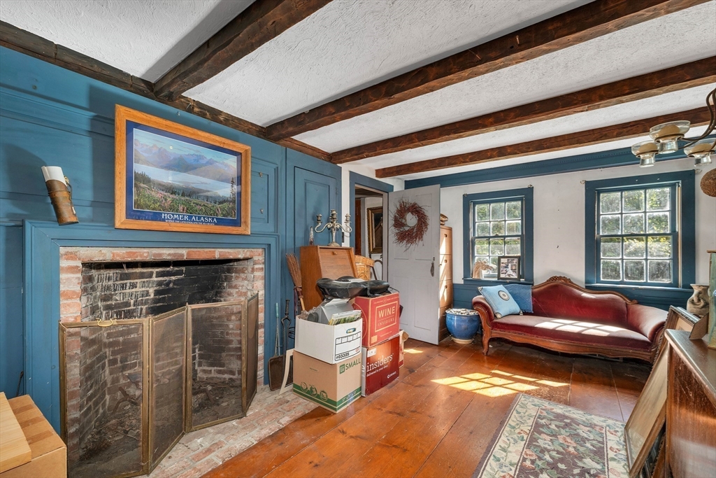 8 Ferry Road Salisbury, MA 01952 - Photo 16 of 42 a living room with furniture and a fireplace