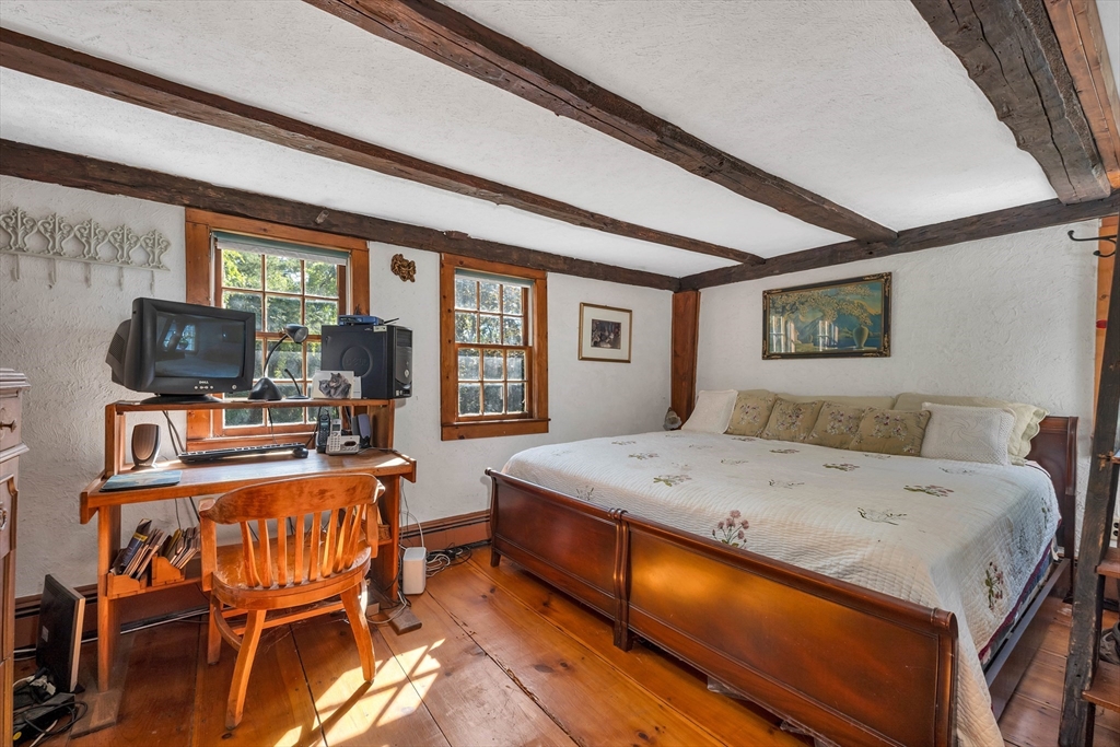 8 Ferry Road Salisbury, MA 01952 - Photo 30 of 42 a bedroom with a bed and large windows