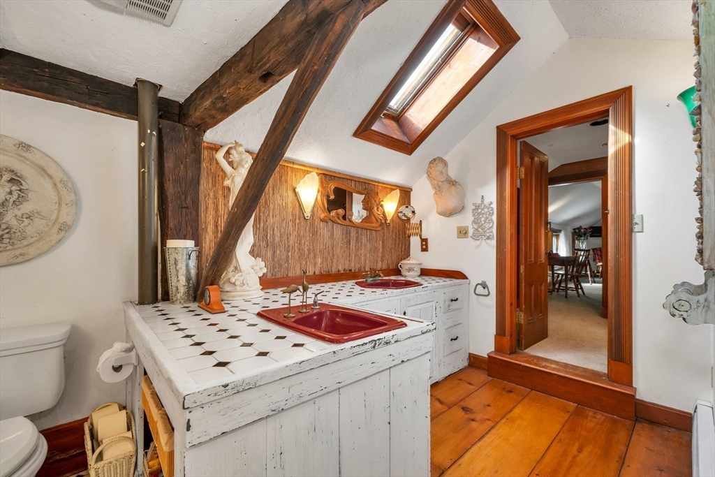 8 Ferry Road Salisbury, MA 01952 - Photo 31 of 42 a bathroom with a sink a toilet and shower