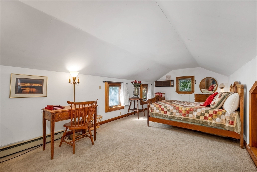 8 Ferry Road Salisbury, MA 01952 - Photo 32 of 42 a bedroom with a bed table chair and a window