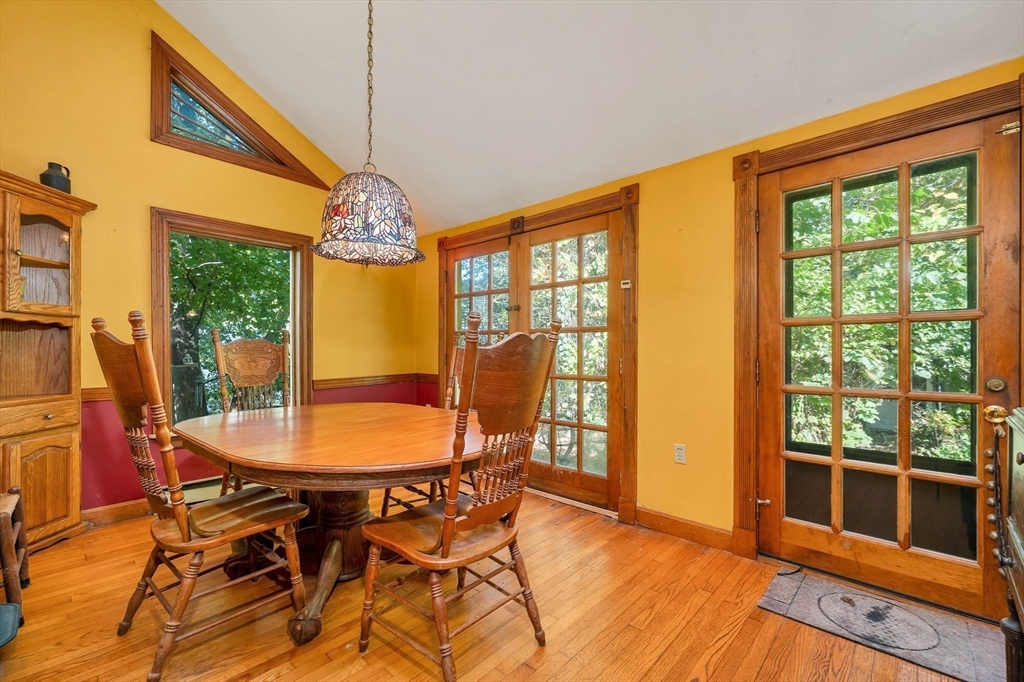 8 Ferry Road Salisbury, MA 01952 - Photo 6 of 42 a dining room with furniture a chandelier and wooden floor