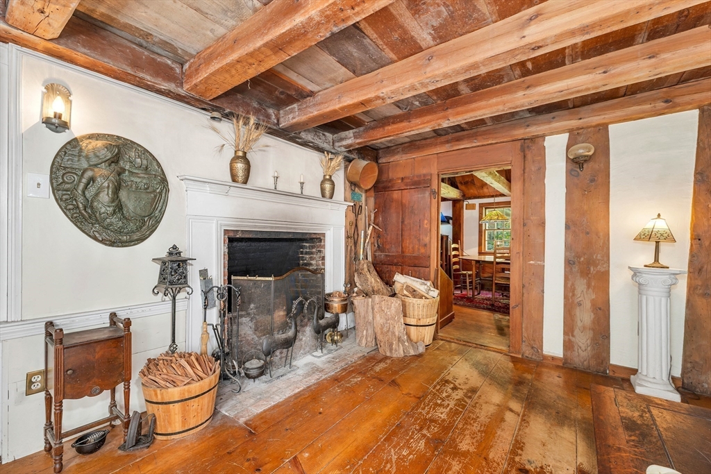 8 Ferry Road Salisbury, MA 01952 - Photo 8 of 42 a living room with furniture a clock and a fireplace
