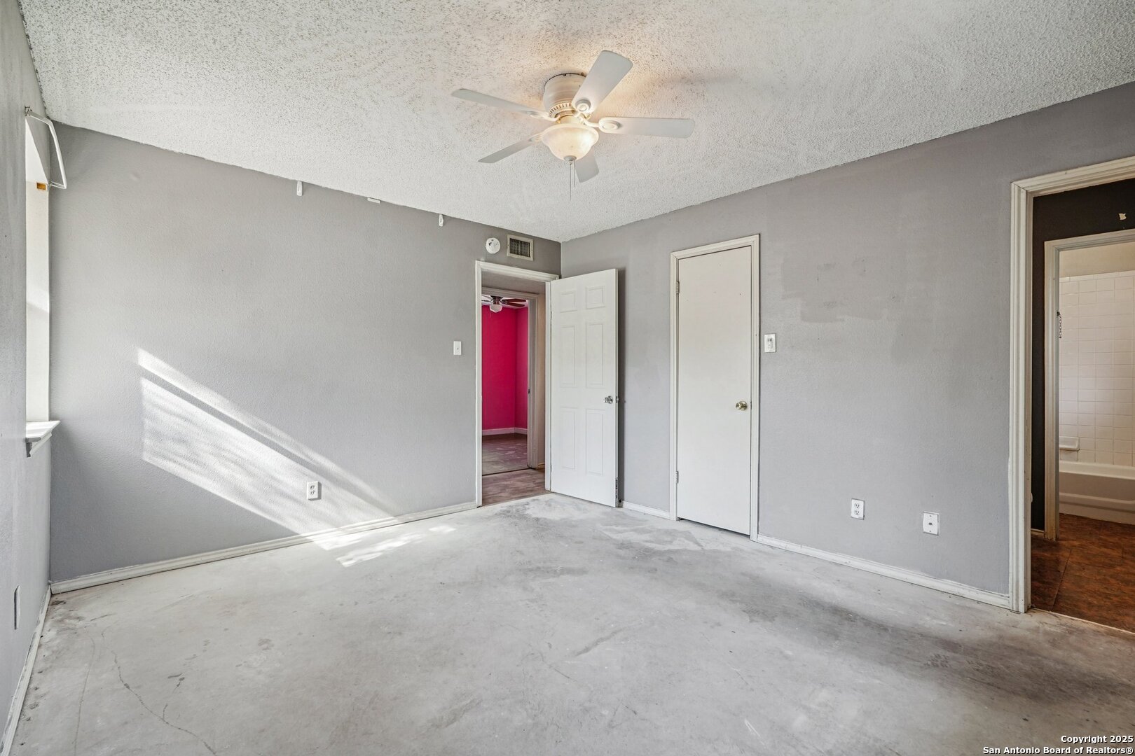 1601 Newton Street Kerrville, TX 78028 - Photo 16 of 23 a view of an empty room with a ceiling fan