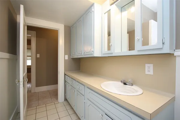 a bathroom with a sink a toilet and vanity