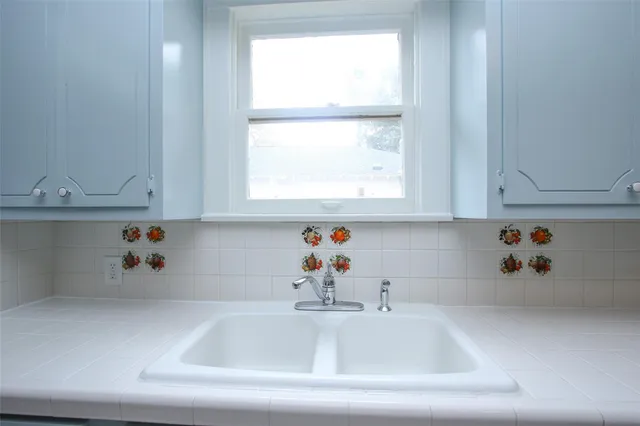 a kitchen with a stove cabinets and refrigerator