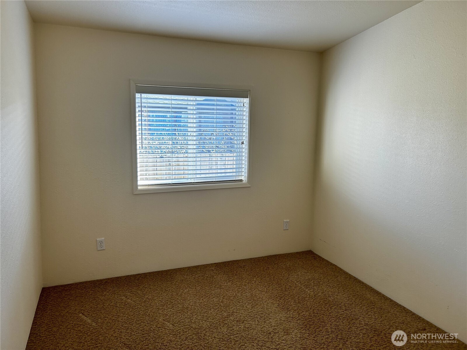 420 Cove Lane Sequim, WA 98382 - Photo 16 of 33 an empty room with a window