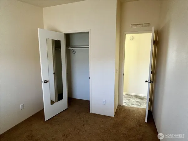 a view of a room with a hallway