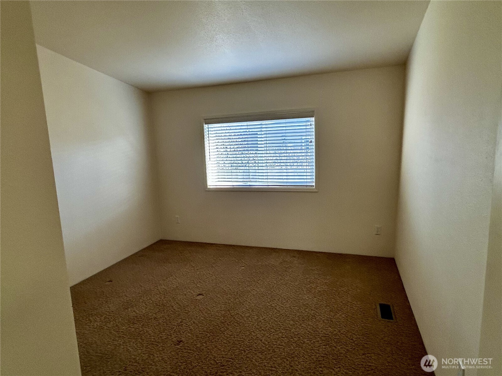 420 Cove Lane Sequim, WA 98382 - Photo 18 of 33 an empty room with a window