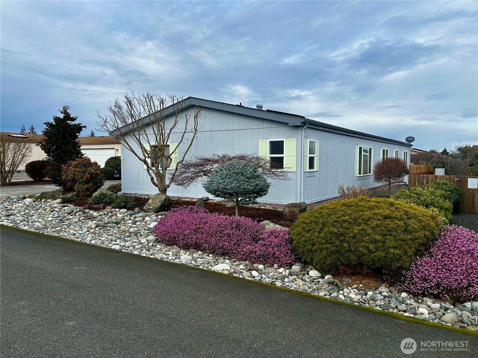 420 Cove Lane Sequim, WA 98382 - Photo 25 of 33 a front view of a house with garden