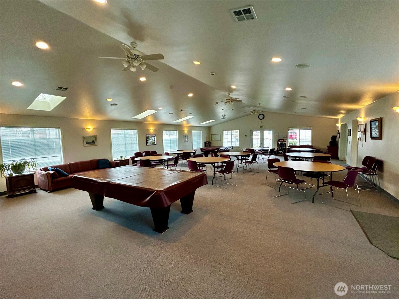 420 Cove Lane Sequim, WA 98382 - Photo 31 of 33 a room with lots of furniture and a chandelier