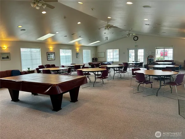 a living room with lots of furniture and a flat screen tv