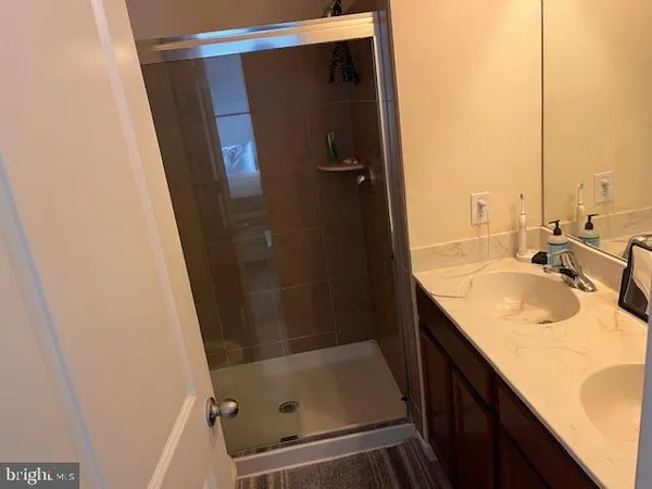 a bathroom with a sink and a shower