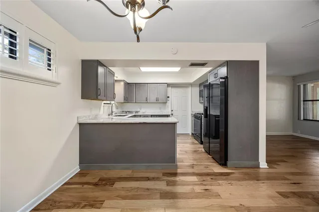 a kitchen with sink cabinets and window