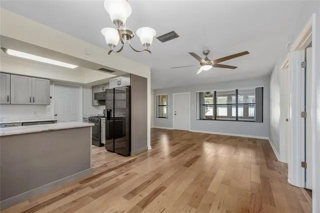 a kitchen with a sink cabinets and window