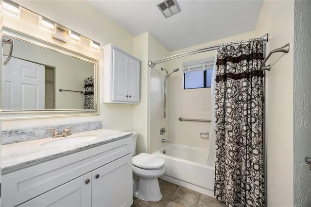 an aerial view of a house with a garden