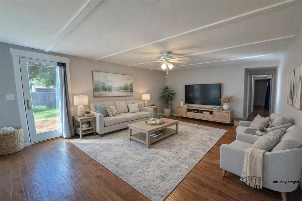 106 Patterson Street Wichita Falls, TX 76301 - Photo 2 of 20 a living room with furniture and a flat screen tv