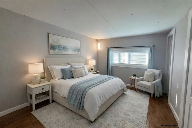 a bedroom with a bed and a couch