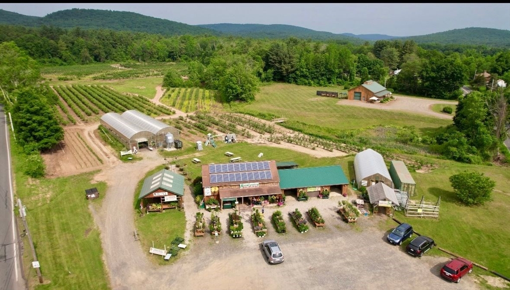an aerial view of a house with a garden