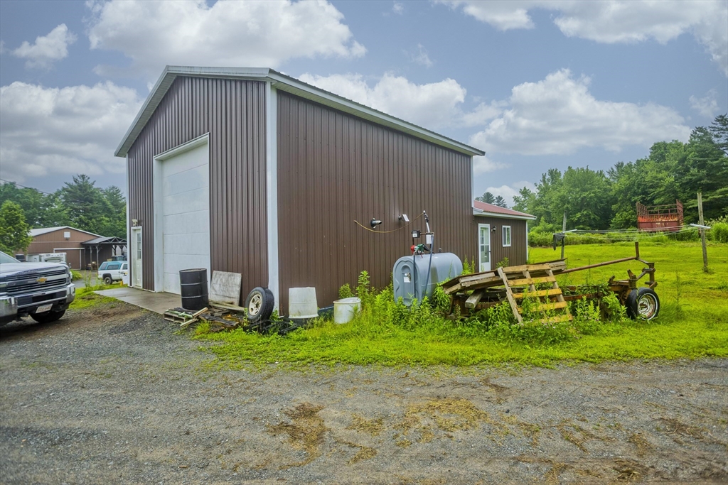 336 Russellville Road Westfield, MA 01085 - Photo 12 of 18 a front view of a house with garden and parking