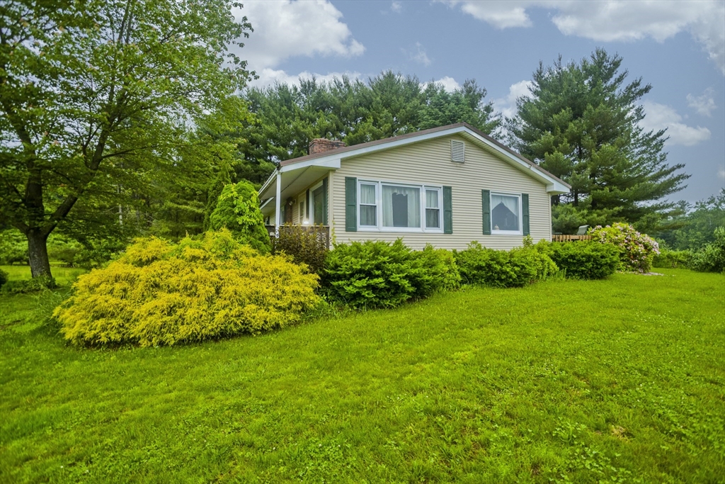 336 Russellville Road Westfield, MA 01085 - Photo 15 of 18 a front view of a house with a garden