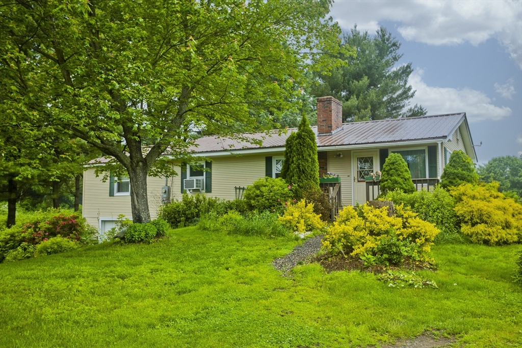 336 Russellville Road Westfield, MA 01085 - Photo 16 of 18 a view of a house with a garden and plants