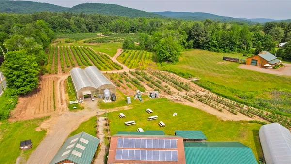 a view of a balcony with an outdoor space and seating area