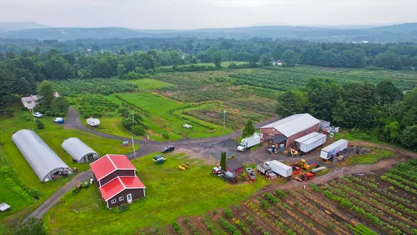 an aerial view of a golf course with outdoor space