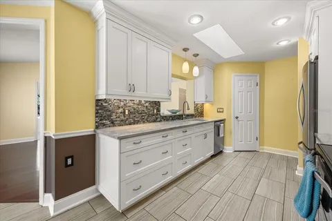 a spacious bathroom with a double vanity sink a mirror and a shower