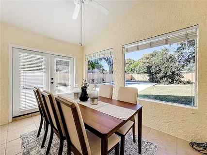 a view of a dining room with furniture window and outside view