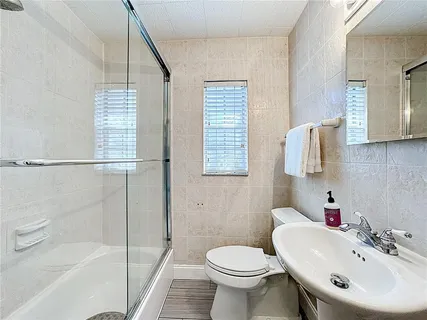 a bathroom with a bathtub and a shower