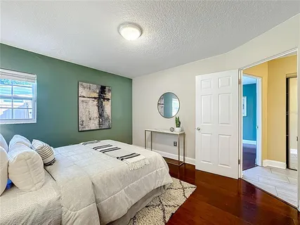 a bedroom with a bed and a walk in closet