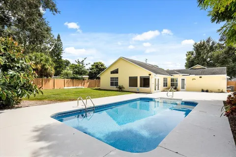 a view of a house with swimming pool