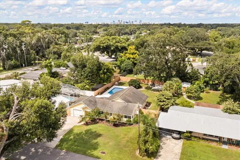 an aerial view of residential houses with outdoor space