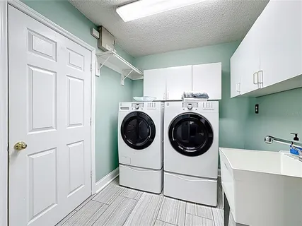 a view of a swimming pool with an outdoor space and seating area