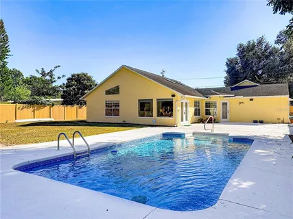 a view of a backyard with a tree