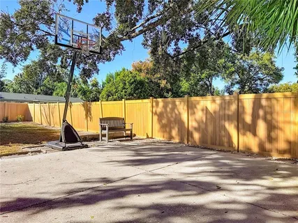 an aerial view of residential houses with outdoor space and swimming pool