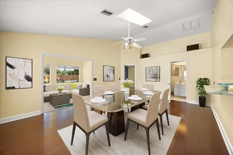 a view of a dining room with furniture and wooden floor