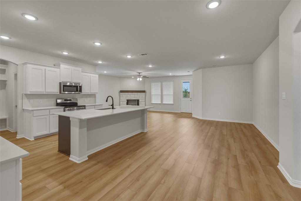 1325 Frio Drive Springtown, TX 76082 - Photo 7 of 24 Open-concept interior featuring wood-finish flooring throughout
