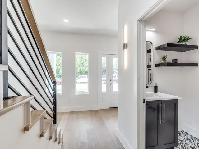 a view of an entryway with wooden floor