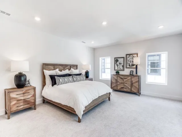 a bedroom with a bed and a couch